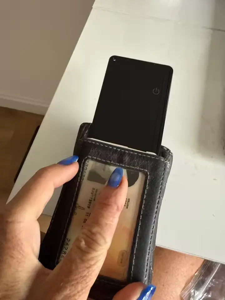 Close-up of FindCard Pro being inserted into a card holder