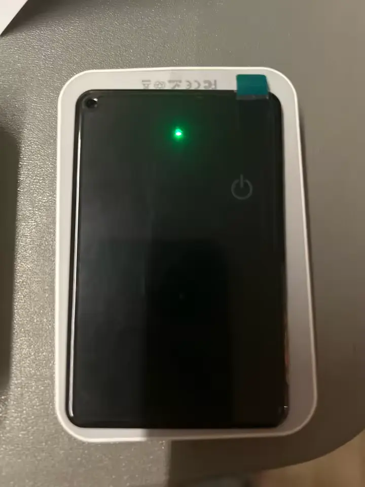FindCard Pro charging with a green LED indicator