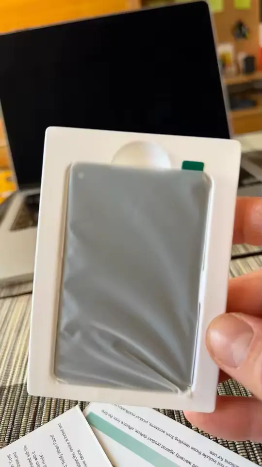 FindCard Pro in its packaging on a laptop